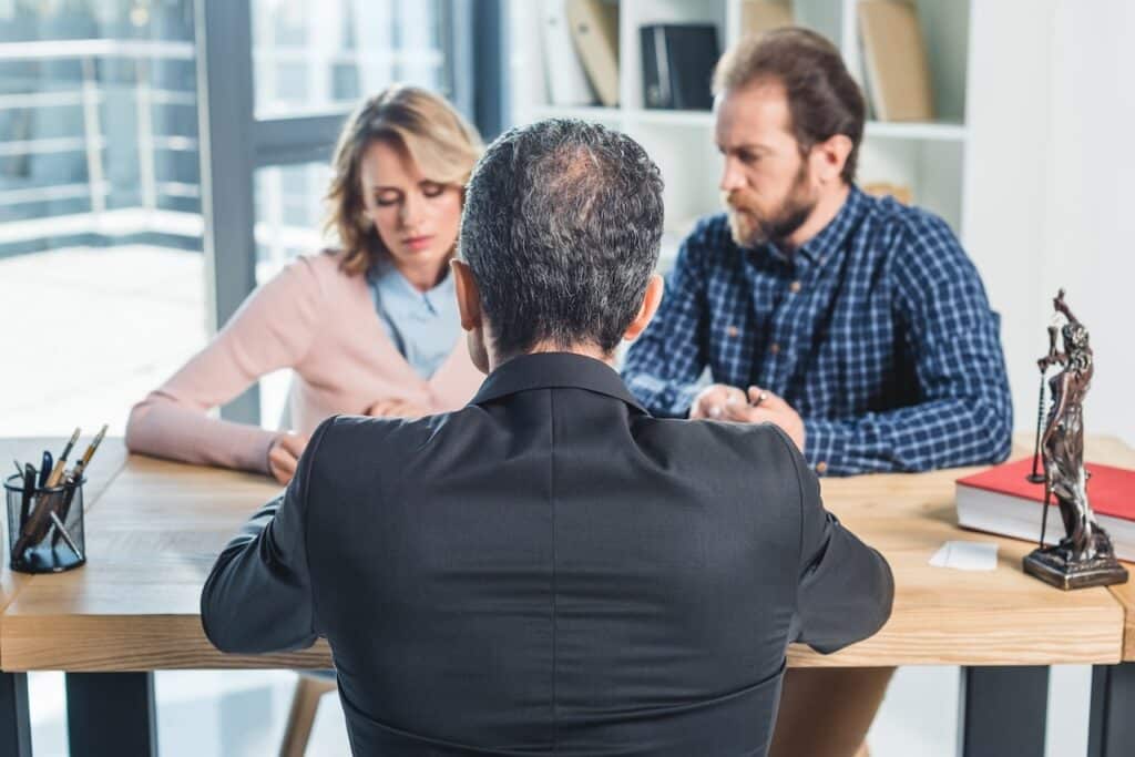 couple talking to lawyer about notice of default