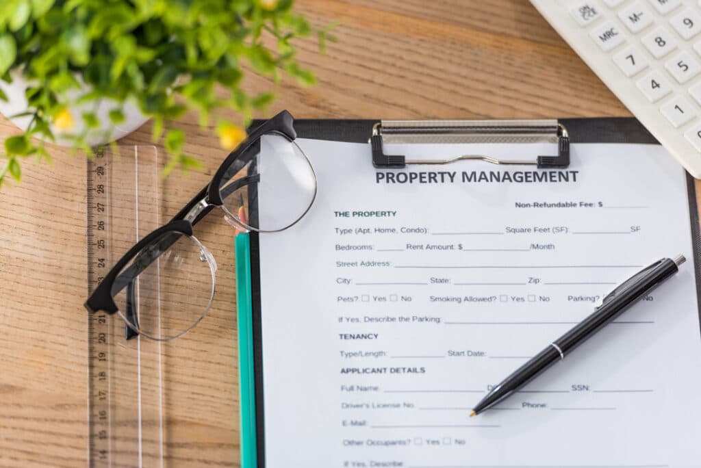 Clipboard with property management form on it