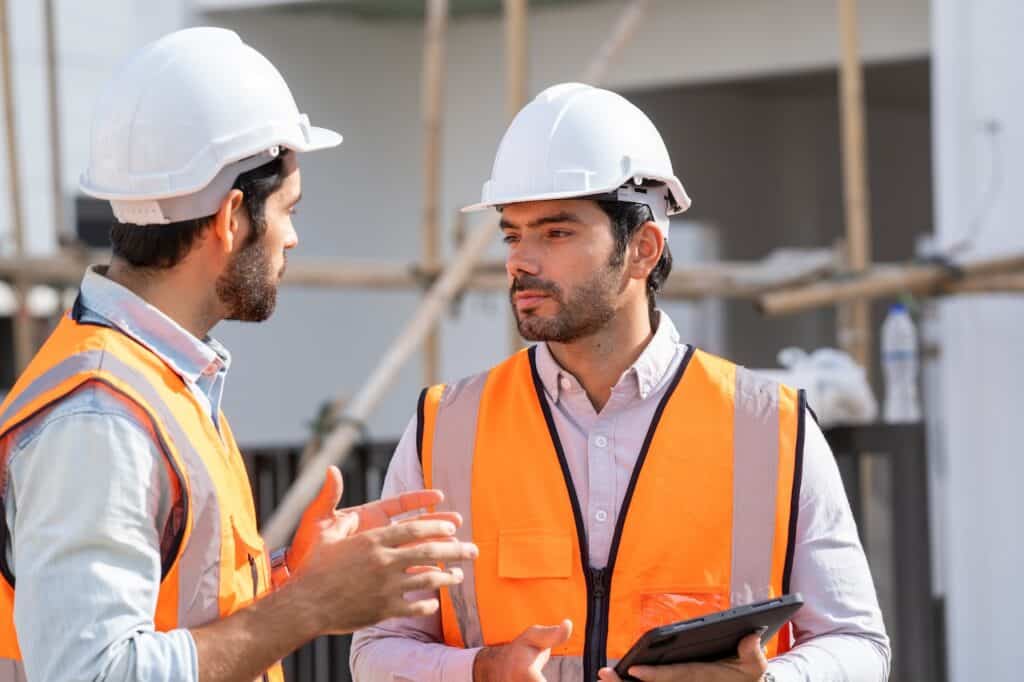 contractors discussing construction delays on site