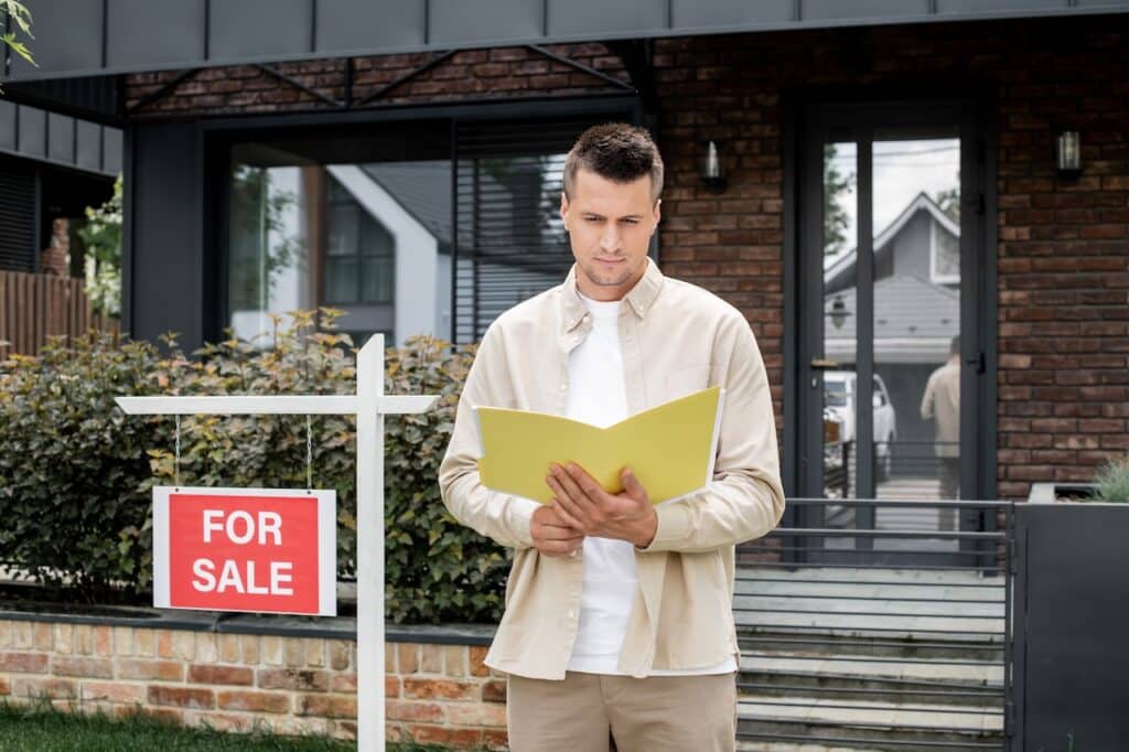 person looking at property deeds for new house